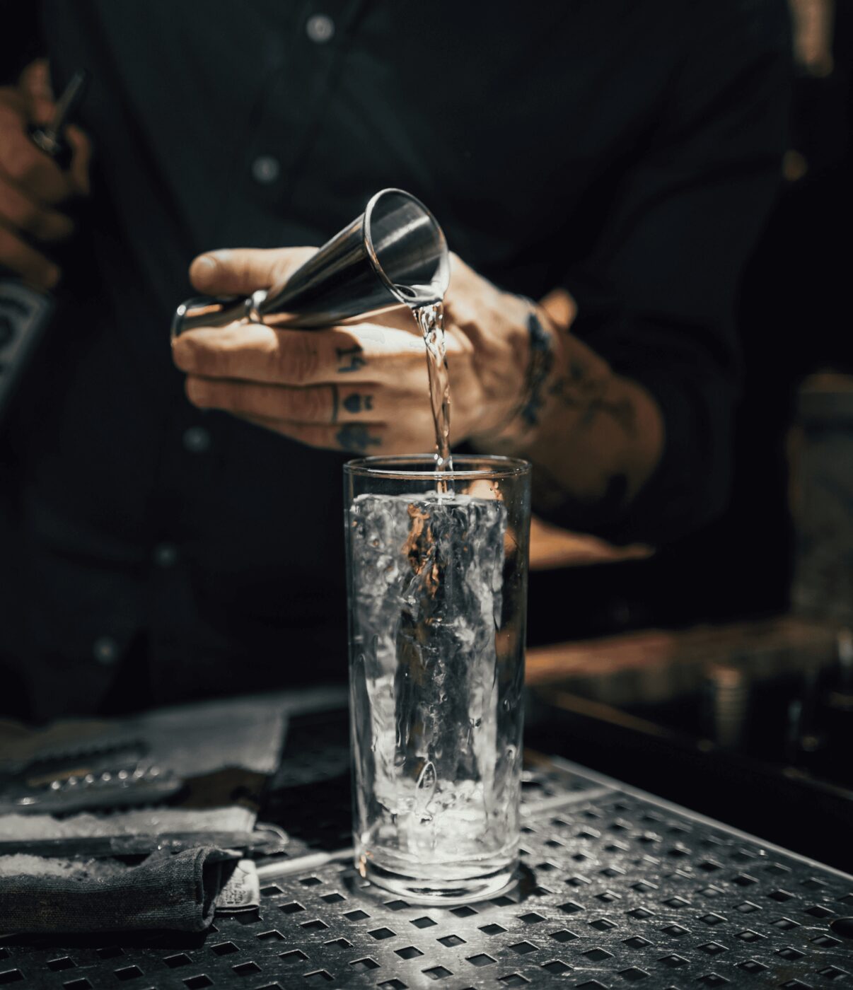 A distiller pouring Blasfemus during the Distiller for a Day experience