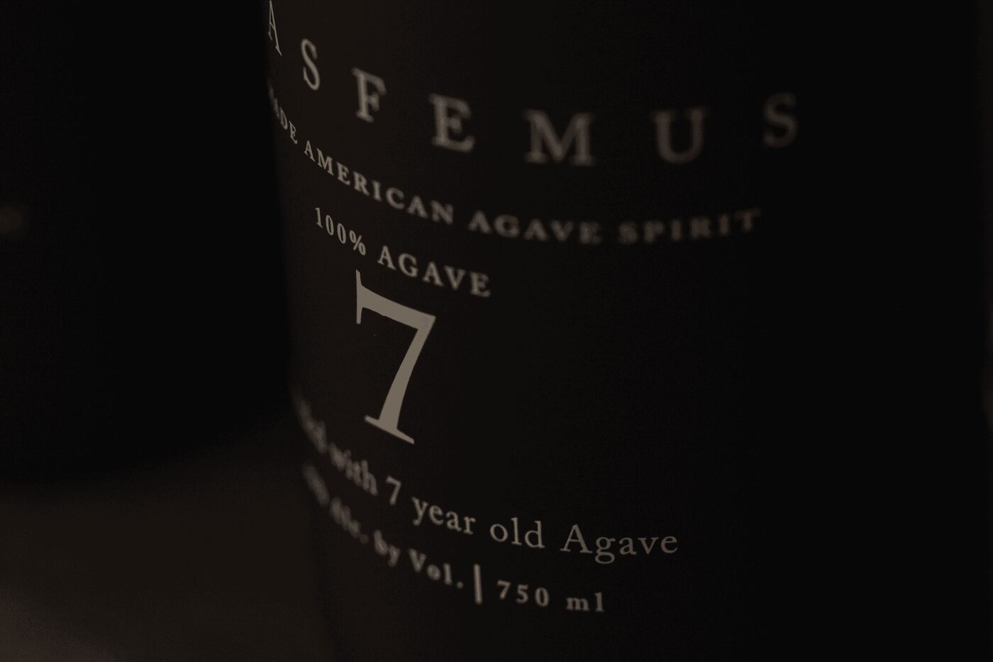 Close-up of the Blasfemus 7 label reading American Agave Spirit, made with 7 year old agave